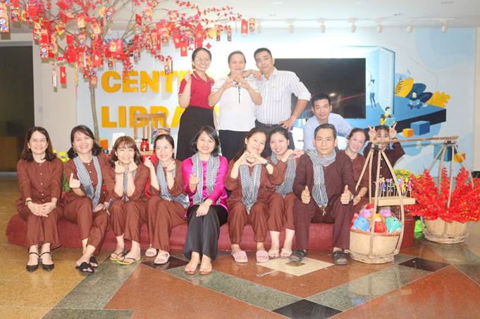 A group of people posing for a photoDescription automatically generated